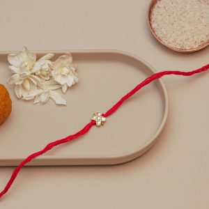 Compact Kundan Rakhi for Brother – Red Thread Rakhi with Four-Leaf Clover Design & Pearl Stones