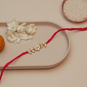 Traditional Kundan Floral Rakhi for Brother – Elegant Red Thread Rakhi with Pearl Work for Raksha Bandhan