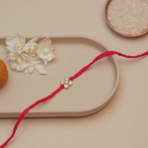 Minimal Kundan Rakhi for Brother – Red Thread Rakhi with Gold-Toned Four-Petal Center Design