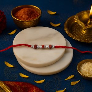 Rudraksha Rakhi – 3 Beads with 925 Silver Accents on Sacred Red Thread